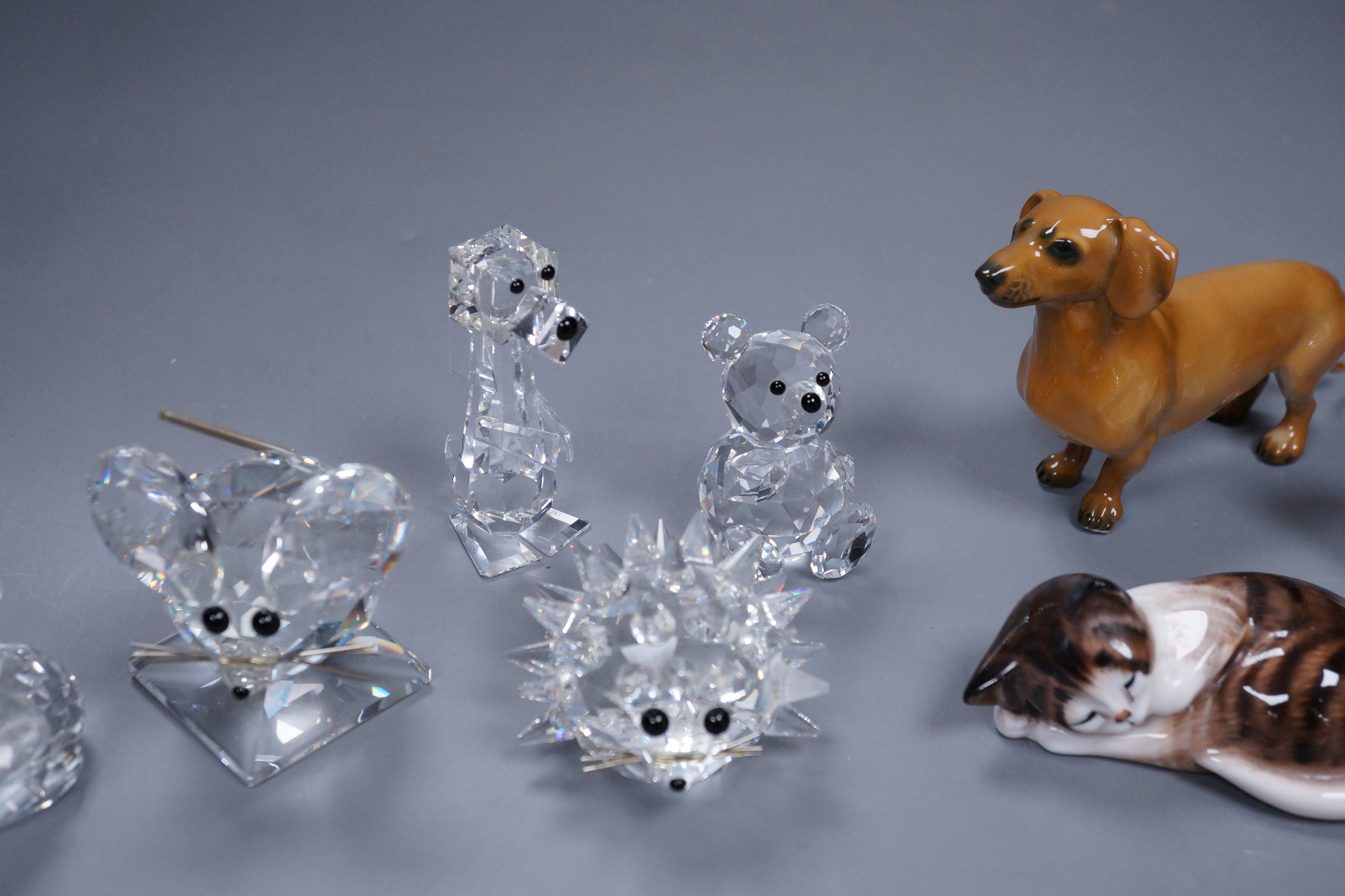 A group of Swarovski crystal (5) and four porcelain animal models, three Doulton and one Rosenthal